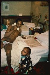 Seun Kuti as a toddler in a photograph with Fela in Fela's bedroom // Fela Kuti's Legacy