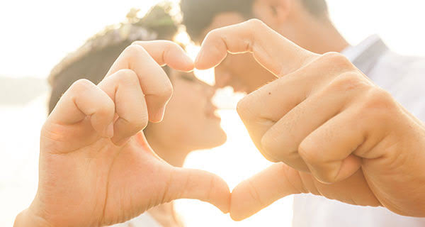 Relationships are a fundamental: Picture of a couple forming love with their hands 