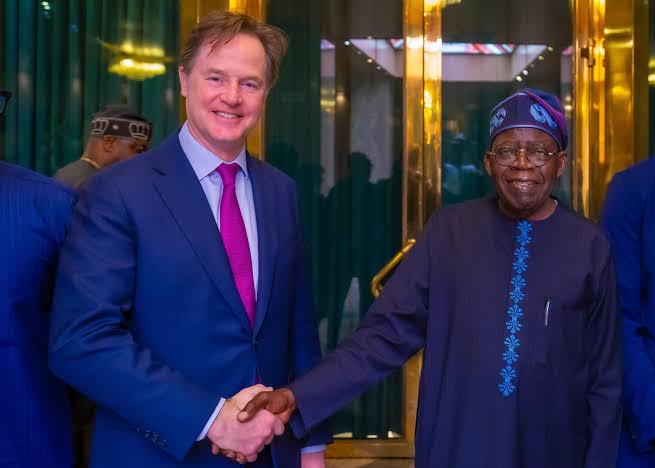 A picture of President Tinubu having a handshake with a foreign male tech official 