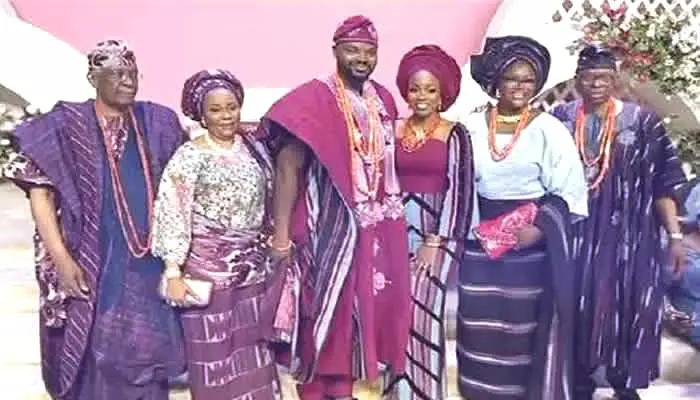 A picture of the son of former Ondo State Governor Olusegun Mimiko and his bride alongside their family