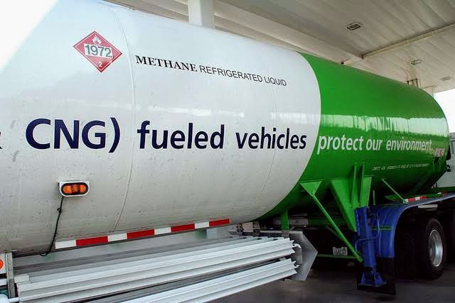 A picture of a gasplant that has "CNG) Fueled Vehicles" boldly written on it