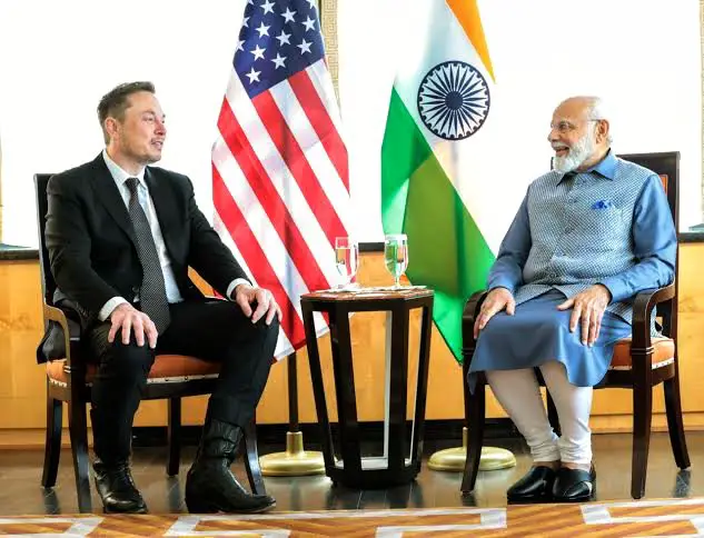A picture of Elon Musk and Prime Minister Modi sitting