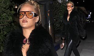 Pictures of Rihanna outside at night,  wearing a black outfit, putting on eyeshades while carring a Louis Vuitton handbag